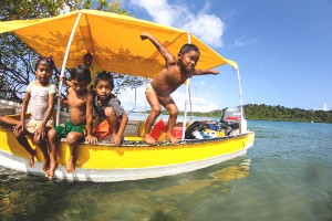 Panamanian Children on a Fishing Boat shot by David Evanko